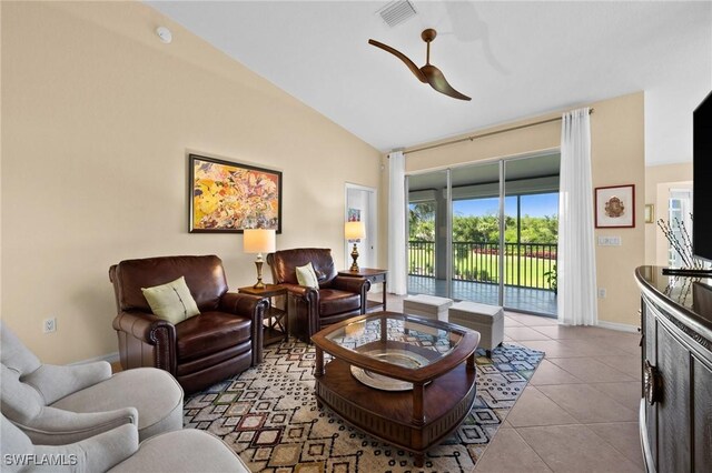6095 Pinnacle Ln Unit 1304, Naples, FL 34110 - tiled living area with lofted ceiling, visible vents, a ceiling fan, and baseboards