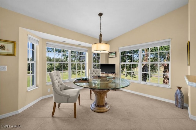 6095 Pinnacle Ln Unit 1304, Naples, FL 34110 - dining space with baseboards, tile patterned flooring, and vaulted ceiling