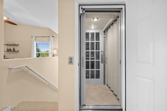 6095 Pinnacle Ln Unit 1304, Naples, FL 34110 - view of exterior entry featuring elevator and a ceiling fan