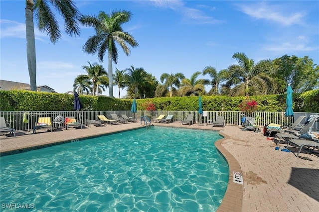 6095 Pinnacle Ln Unit 1304, Naples, FL 34110 - pool with fence and a patio