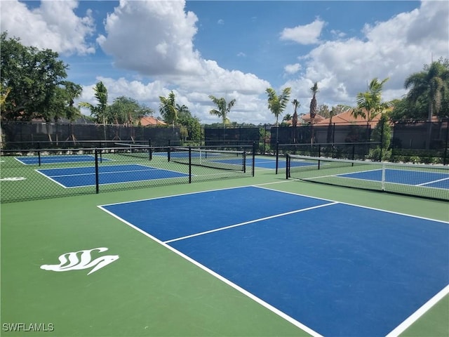 6095 Pinnacle Ln Unit 1304, Naples, FL 34110 - view of tennis court with fence