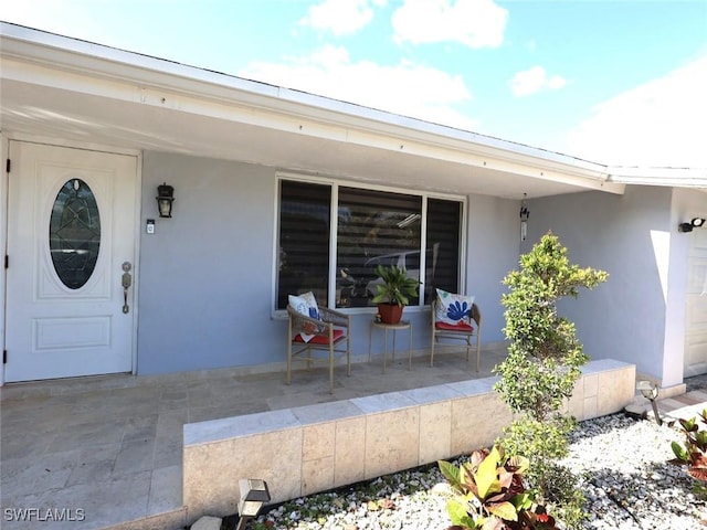 9170 24th Pl, Sunrise, FL 33322 - entrance to property with stucco siding and covered porch