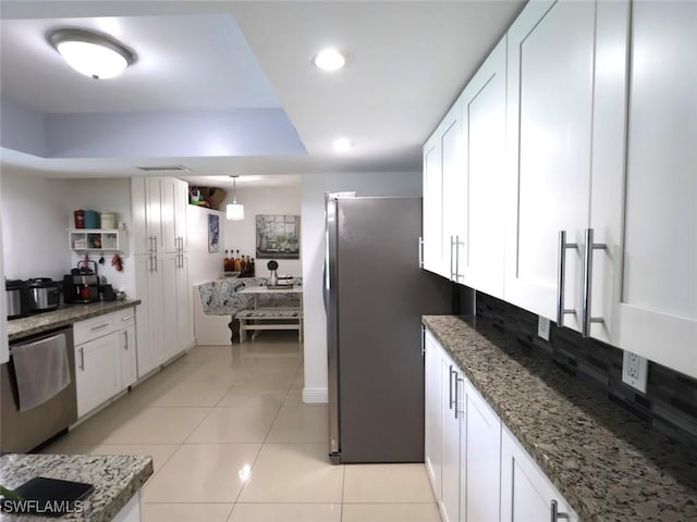 9170 24th Pl, Sunrise, FL 33322 - kitchen with white cabinets, light stone countertops, and appliances with stainless steel finishes