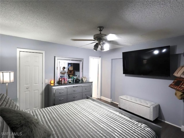 9170 24th Pl, Sunrise, FL 33322 - bedroom with dark wood-style flooring, baseboards, and a textured ceiling