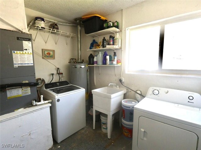 9170 24th Pl, Sunrise, FL 33322 - laundry area featuring independent washer and dryer, laundry area, heating unit, and a textured ceiling