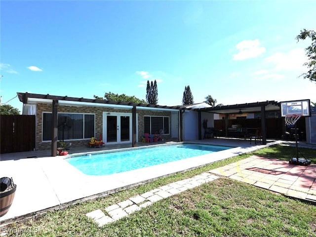 9170 24th Pl, Sunrise, FL 33322 - pool featuring french doors, fence, and a patio