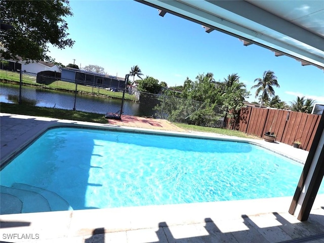 9170 24th Pl, Sunrise, FL 33322 - view of pool with a fenced in pool, fence, and a water view