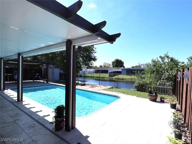 9170 24th Pl, Sunrise, FL 33322 - view of pool with an outbuilding, a shed, a patio area, fence, and a fenced in pool