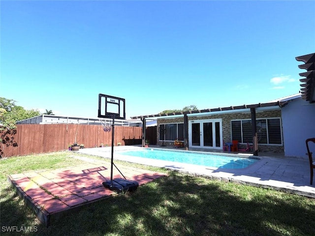 9170 24th Pl, Sunrise, FL 33322 - view of pool featuring a patio area, a fenced in pool, fence, and a lawn