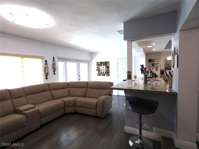 9170 24th Pl, Sunrise, FL 33322 - living room featuring visible vents and dark wood finished floors