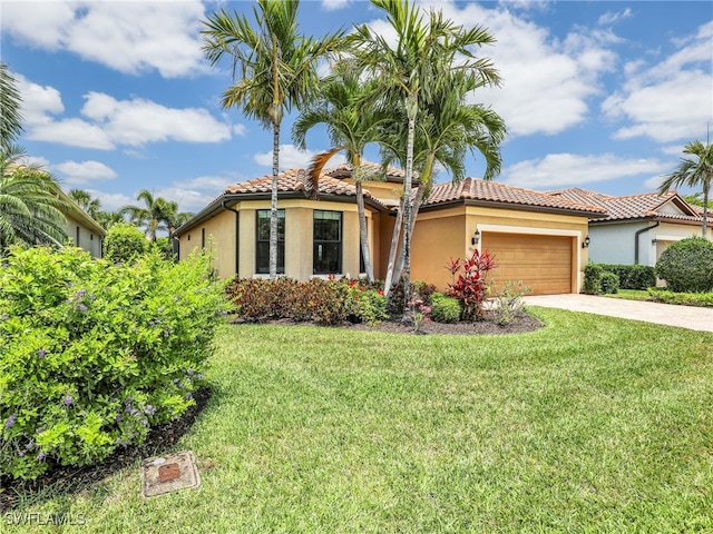 13530 Villa Di Preserve Ln, Estero, FL 33928 - mediterranean / spanish-style house featuring stucco siding, concrete driveway, an attached garage, and a front lawn