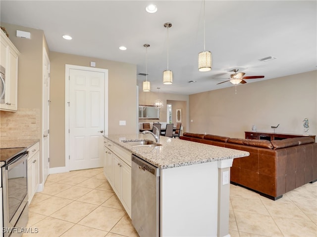 13530 Villa Di Preserve Ln, Estero, FL 33928 - kitchen featuring appliances with stainless steel finishes, light tile patterned flooring, a ceiling fan, recessed lighting, and tasteful backsplash