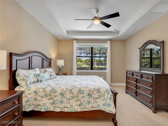 13530 Villa Di Preserve Ln, Estero, FL 33928 - bedroom with light carpet, a tray ceiling, and a ceiling fan
