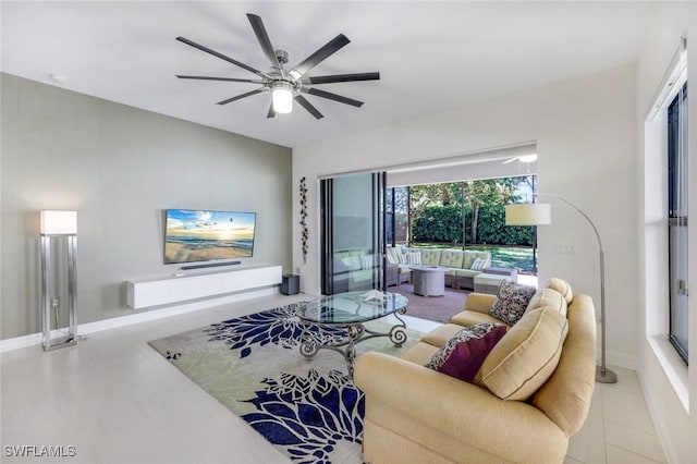 3267 Pacific Dr, Naples, FL 34119 - tiled living room featuring a ceiling fan and baseboards