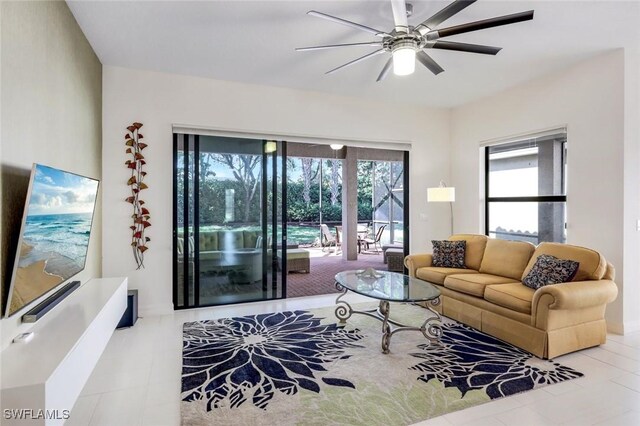3267 Pacific Dr, Naples, FL 34119 - tiled living area featuring a ceiling fan