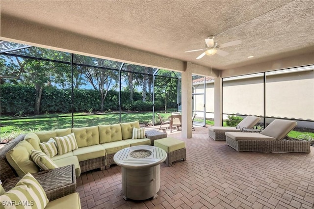 3267 Pacific Dr, Naples, FL 34119 - sunroom with outdoor lounge area, a ceiling fan, and view of scattered trees