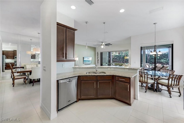 3267 Pacific Dr, Naples, FL 34119 - kitchen featuring appliances with stainless steel finishes, a sink, plenty of natural light, a peninsula, and recessed lighting