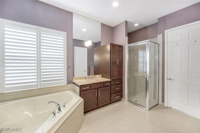 3267 Pacific Dr, Naples, FL 34119 - full bath with a stall shower, a bath, vanity, and recessed lighting