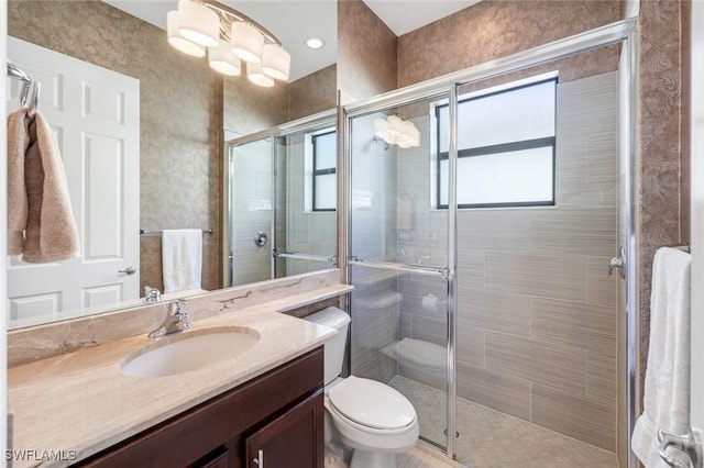 3267 Pacific Dr, Naples, FL 34119 - full bathroom featuring a stall shower, vanity, and toilet