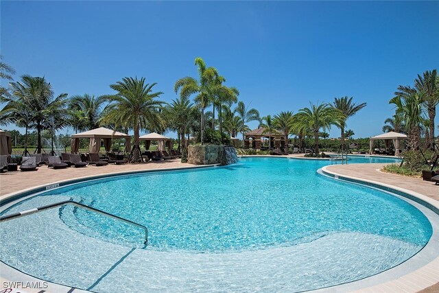 3267 Pacific Dr, Naples, FL 34119 - community pool with a gazebo and a patio