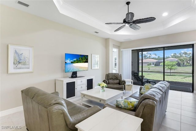 living room featuring a tray ceiling, visible vents, recessed lighting, a ceiling fan, and light tile patterned floors