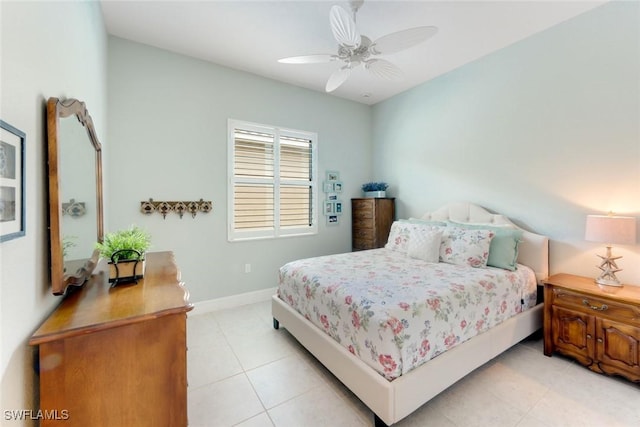 bedroom featuring ceiling fan, baseboards, and light tile patterned floors