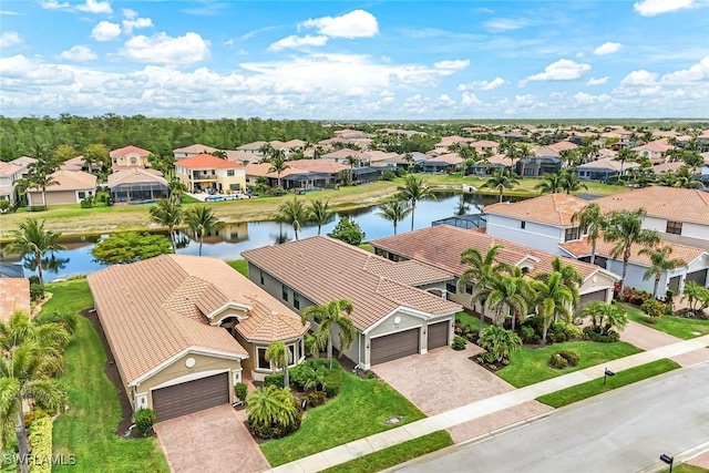 bird's eye view featuring a residential view and a water view