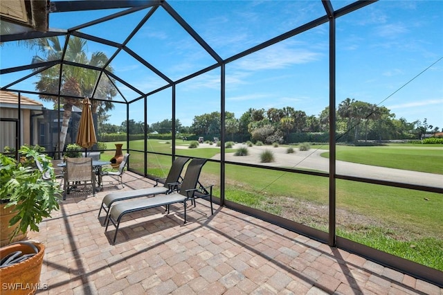 12732 Fox Ridge Dr, Bonita Springs, FL 34135 - unfurnished sunroom featuring view of golf course and outdoor dining area