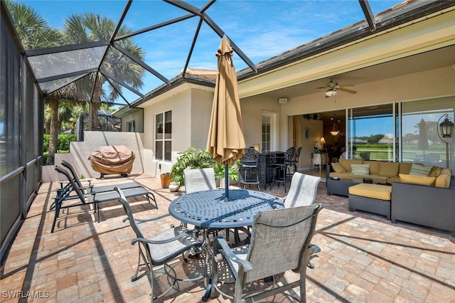 12732 Fox Ridge Dr, Bonita Springs, FL 34135 - view of patio with outdoor dining space, a lanai, outdoor lounge area, and a ceiling fan