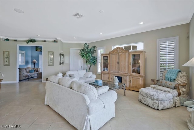 12732 Fox Ridge Dr, Bonita Springs, FL 34135 - living room featuring crown molding, light tile patterned floors, visible vents, and recessed lighting