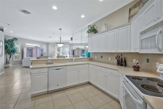12732 Fox Ridge Dr, Bonita Springs, FL 34135 - kitchen with plenty of natural light, open floor plan, white appliances, a peninsula, and a sink