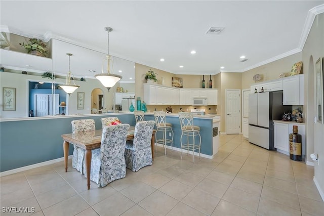 12732 Fox Ridge Dr, Bonita Springs, FL 34135 - dining space featuring baseboards, recessed lighting, crown molding, light tile patterned flooring, and visible vents