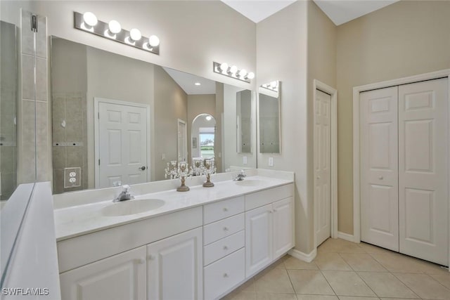 12732 Fox Ridge Dr, Bonita Springs, FL 34135 - bathroom with a closet, double vanity, a sink, and tile patterned flooring