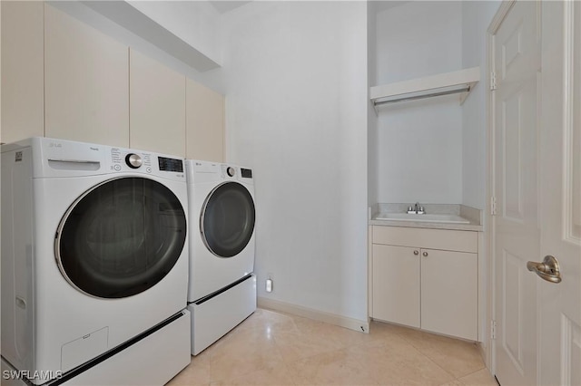 15890 Delasol Ln, Naples, FL 34110 - laundry area with washing machine and dryer, cabinet space, and light tile patterned floors