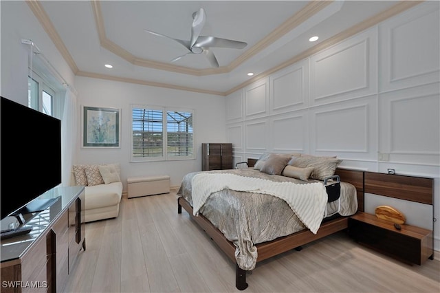15890 Delasol Ln, Naples, FL 34110 - bedroom with ornamental molding, a raised ceiling, light wood-style flooring, recessed lighting, and ceiling fan