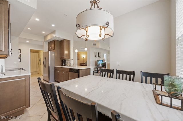 18276 Creekside Preserve Loop Unit 102, Fort Myers, FL 33908 - dining area with light tile patterned floors, a chandelier, and recessed lighting