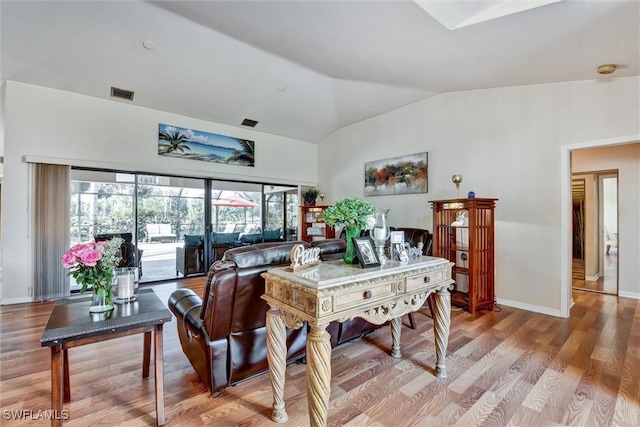 1803 Golfside Village Dr, Lehigh Acres, FL 33936 - dining area featuring lofted ceiling, light wood-style flooring, and baseboards