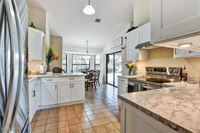 1803 Golfside Village Dr, Lehigh Acres, FL 33936 - kitchen with stainless steel appliances, lofted ceiling, a peninsula, white cabinets, and pendant lighting