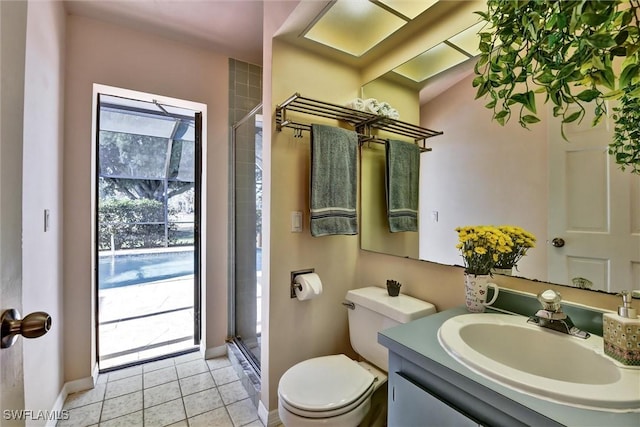 1803 Golfside Village Dr, Lehigh Acres, FL 33936 - full bathroom with a stall shower, toilet, baseboards, tile patterned flooring, and vanity