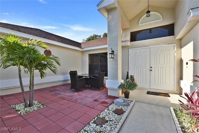 1803 Golfside Village Dr, Lehigh Acres, FL 33936 - property entrance with a patio and stucco siding