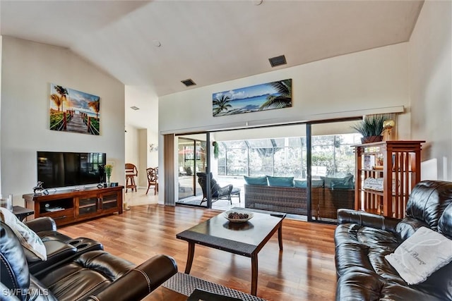 1803 Golfside Village Dr, Lehigh Acres, FL 33936 - living area featuring wood finished floors and high vaulted ceiling