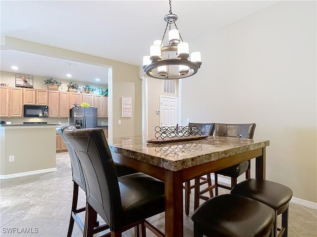 13885 Cleto Dr, Estero, FL 33928 - dining area featuring recessed lighting, light tile patterned floors, baseboards, and an inviting chandelier