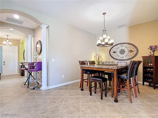 13885 Cleto Dr, Estero, FL 33928 - dining space featuring visible vents, arched walkways, and a notable chandelier