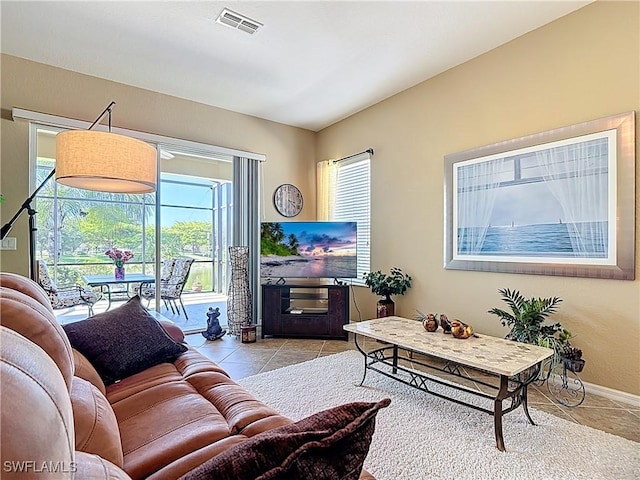 13885 Cleto Dr, Estero, FL 33928 - tiled living room with visible vents and baseboards