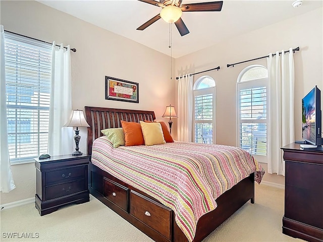 13885 Cleto Dr, Estero, FL 33928 - bedroom featuring light carpet, baseboards, and ceiling fan