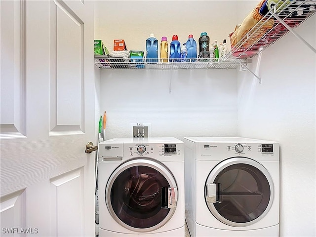 13885 Cleto Dr, Estero, FL 33928 - clothes washing area with washer and clothes dryer and laundry area