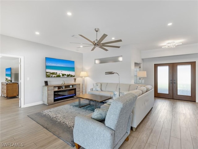 14701 Eden St, Fort Myers, FL 33908 - living room with french doors, baseboards, recessed lighting, a ceiling fan, and wood finished floors