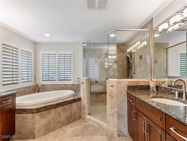 14701 Eden St, Fort Myers, FL 33908 - bathroom with a shower stall, tile patterned floors, a bath, vanity, and visible vents