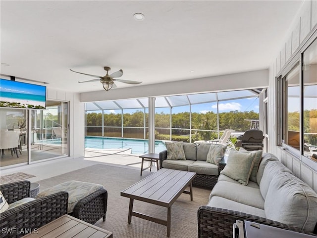 14701 Eden St, Fort Myers, FL 33908 - living room with ceiling fan, a wealth of natural light, a sunroom, and carpet