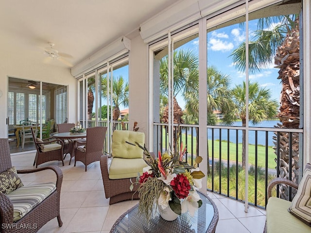 2325 Mont Claire Dr Unit 201, Naples, FL 34109 - sunroom with a healthy amount of sunlight, a water view, and tile patterned flooring